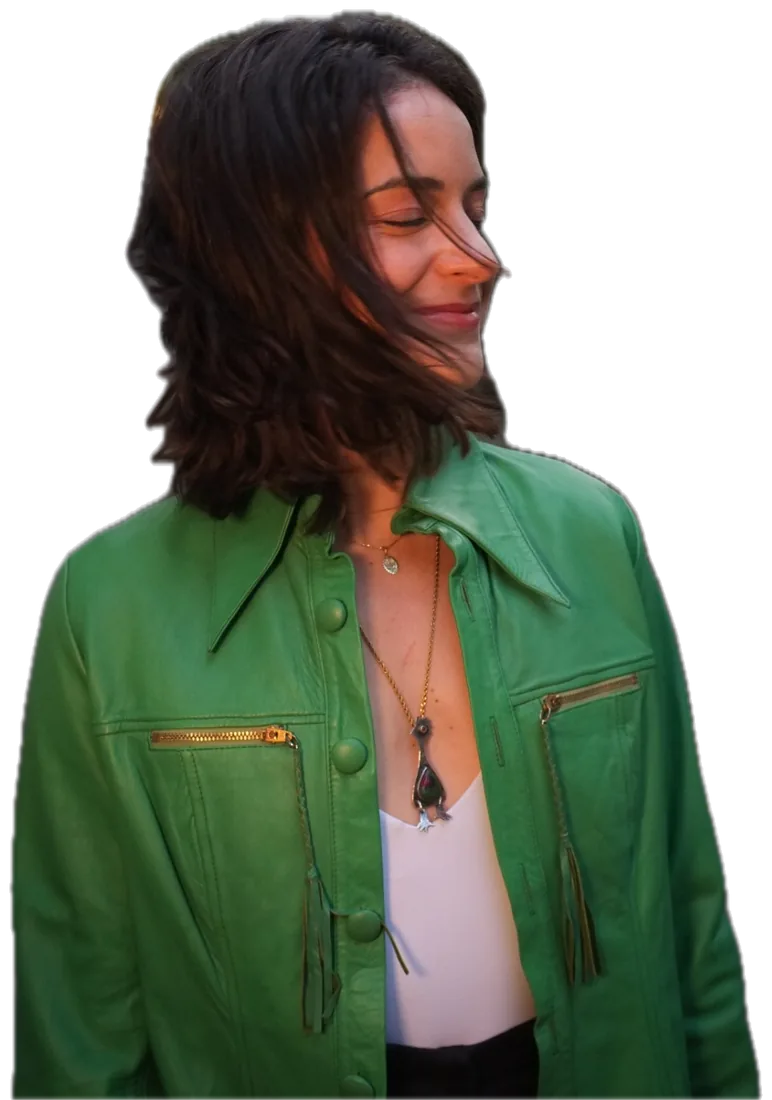 Alyssa smiling in a green jacket